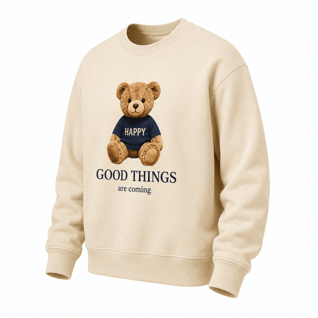 Beige sweatshirt with a teddy bear and text on a white background